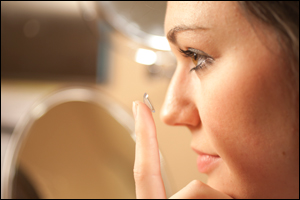 student trying out contact lens